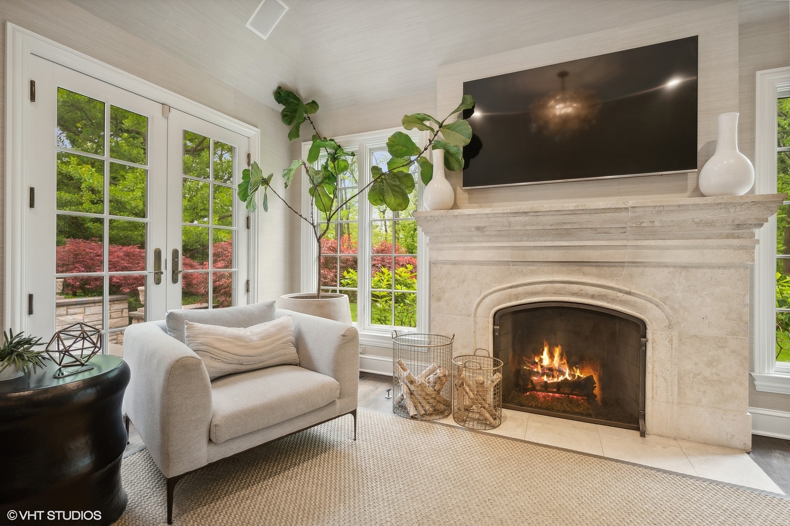 851 Sheridan Road Winnetka, IL 60093 - Photo 27 of 66 a living room with a fireplace and a flat screen tv