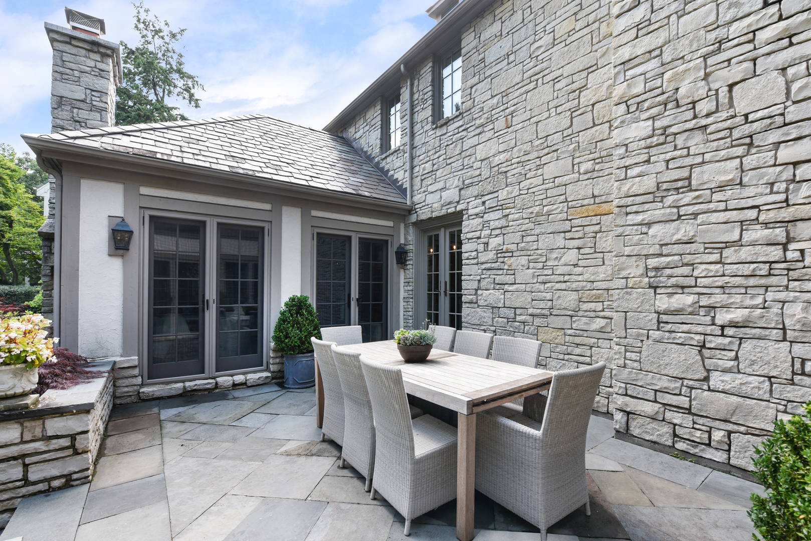 851 Sheridan Road Winnetka, IL 60093 - Photo 30 of 66 a view of a patio with table and chairs and potted plants