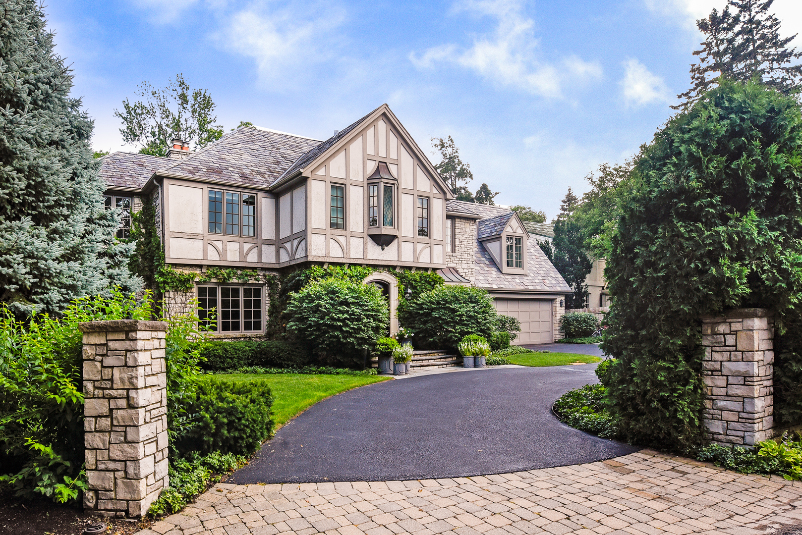 851 Sheridan Road Winnetka, IL 60093 - Photo 3 of 66 a view of a house with a yard and plants