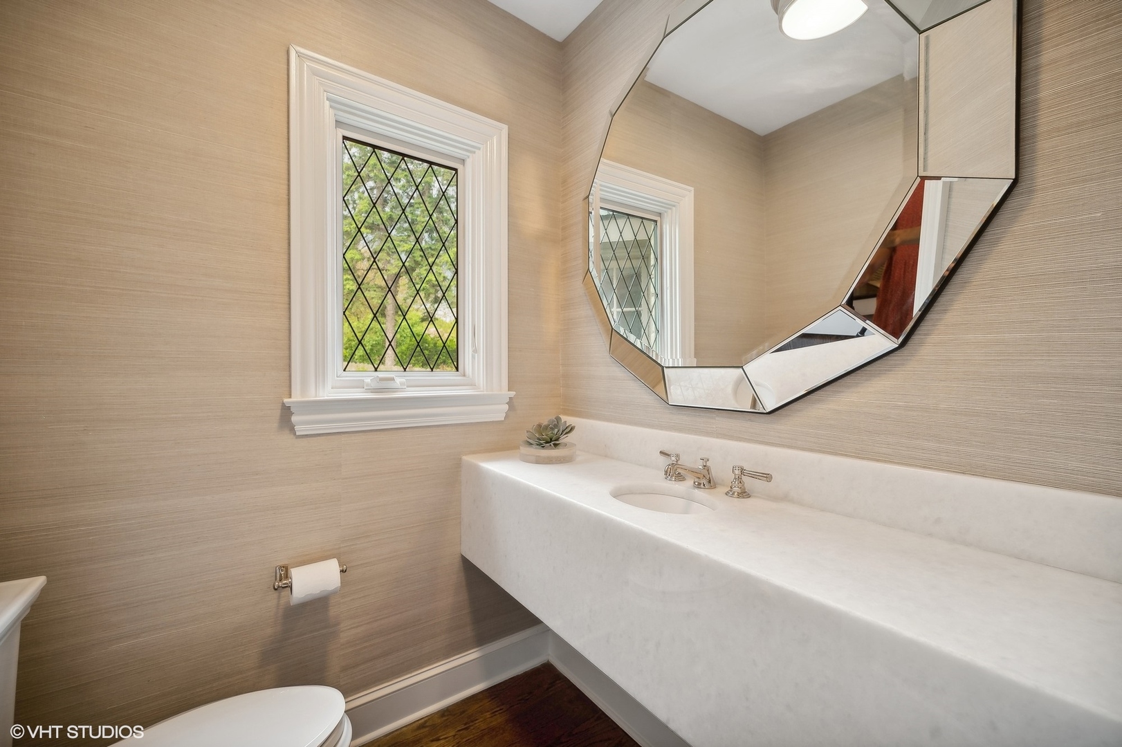 851 Sheridan Road Winnetka, IL 60093 - Photo 38 of 66 a bathroom with a sink a mirror a toilet and a window