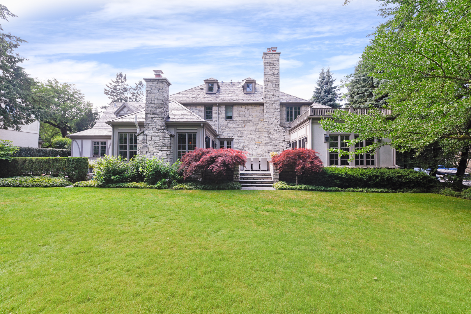 851 Sheridan Road Winnetka, IL 60093 - Photo 56 of 66 a front view of a house with a garden