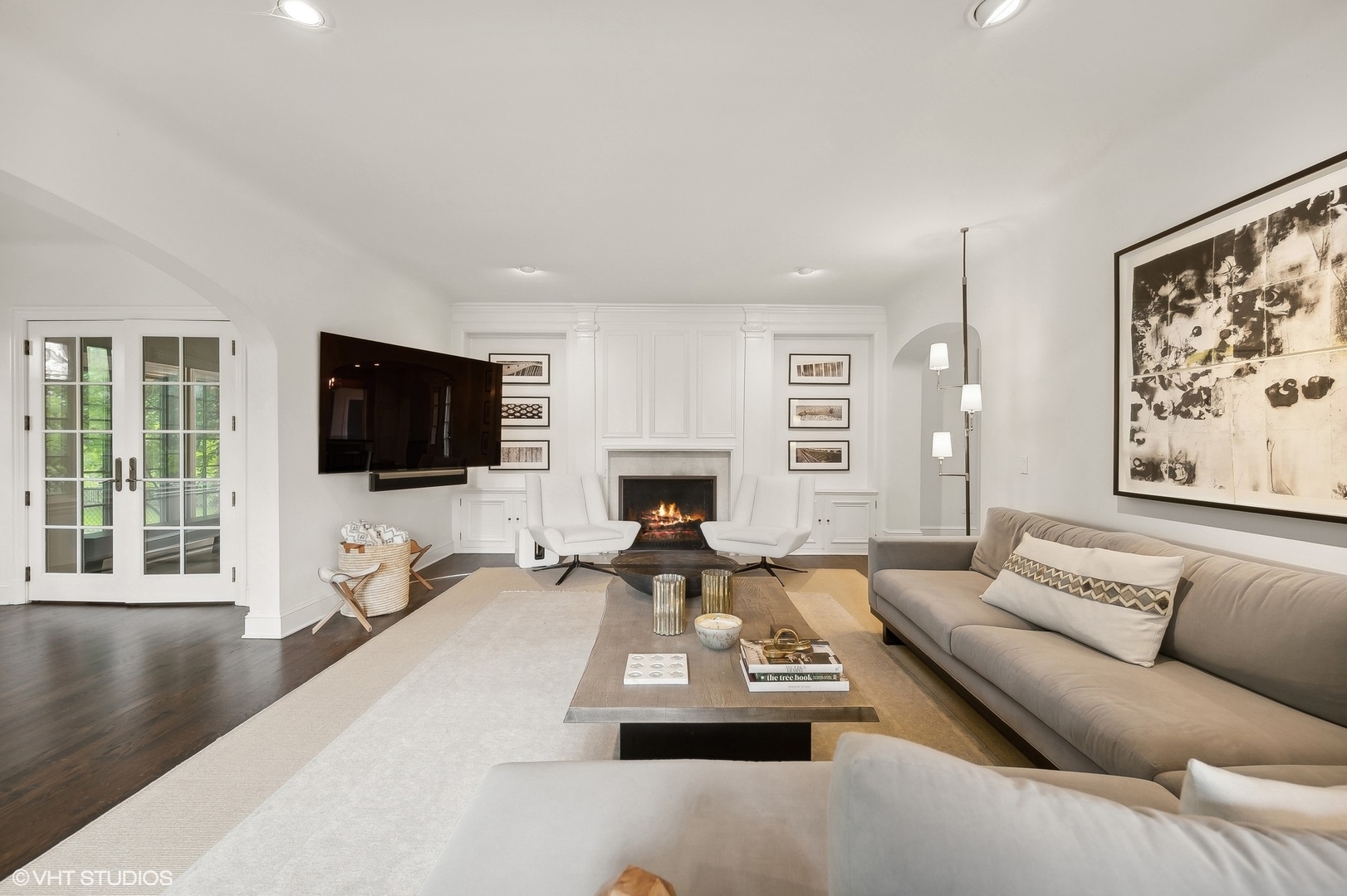 851 Sheridan Road Winnetka, IL 60093 - Photo 9 of 66 a living room with furniture a fireplace and a flat screen tv