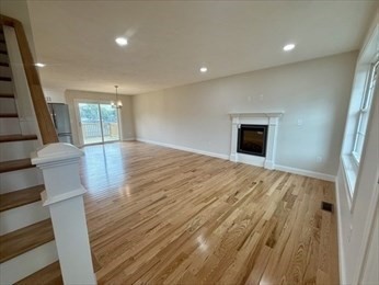 70 Oswego Street Bellingham, MA 02019 - Photo 28 of 28 a view of an empty room with wooden floor and a window