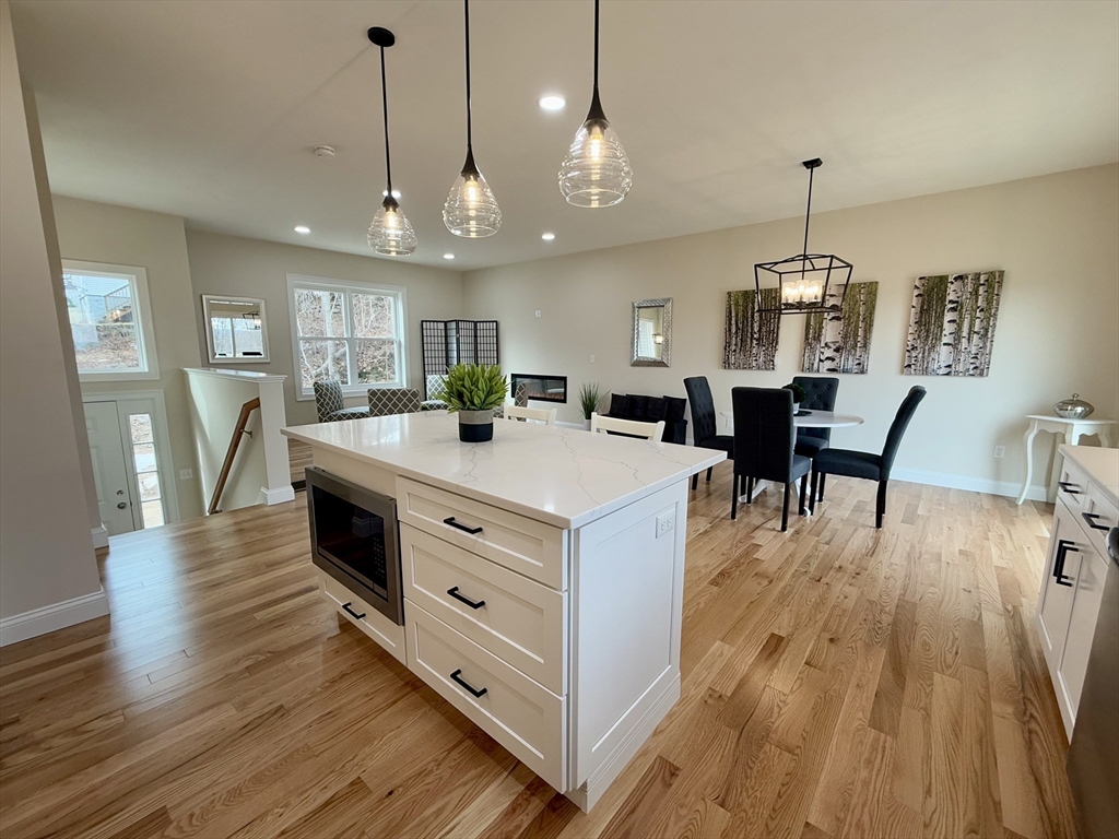 70 Oswego Street Bellingham, MA 02019 - Photo 7 of 28 a view of kitchen and dining room