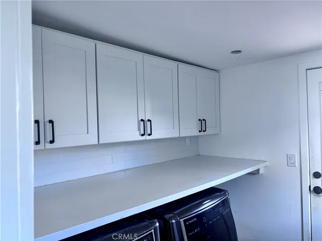 a view of cabinets and wooden floor in cabinets