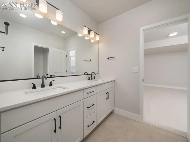a white bath tub sitting next to a toilet
