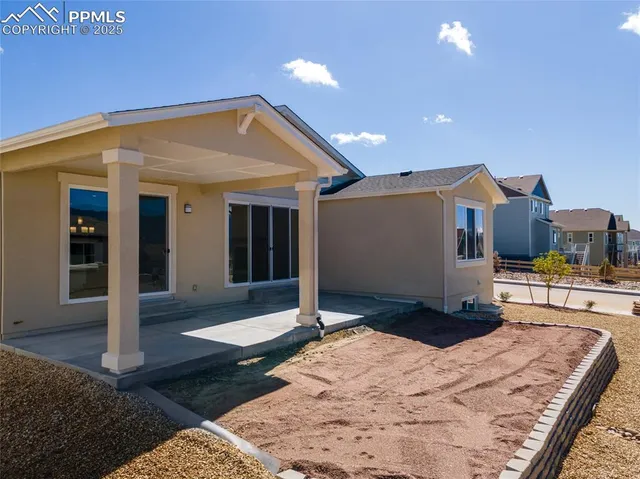 a terrace with outdoor seating and city view