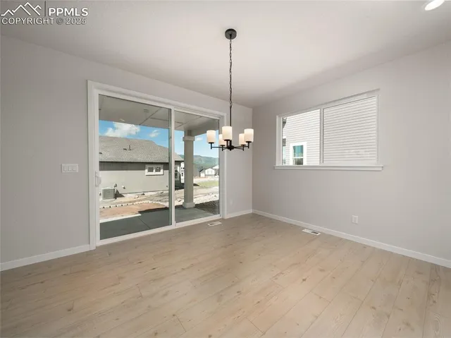 a view of a room with cabinet and windows