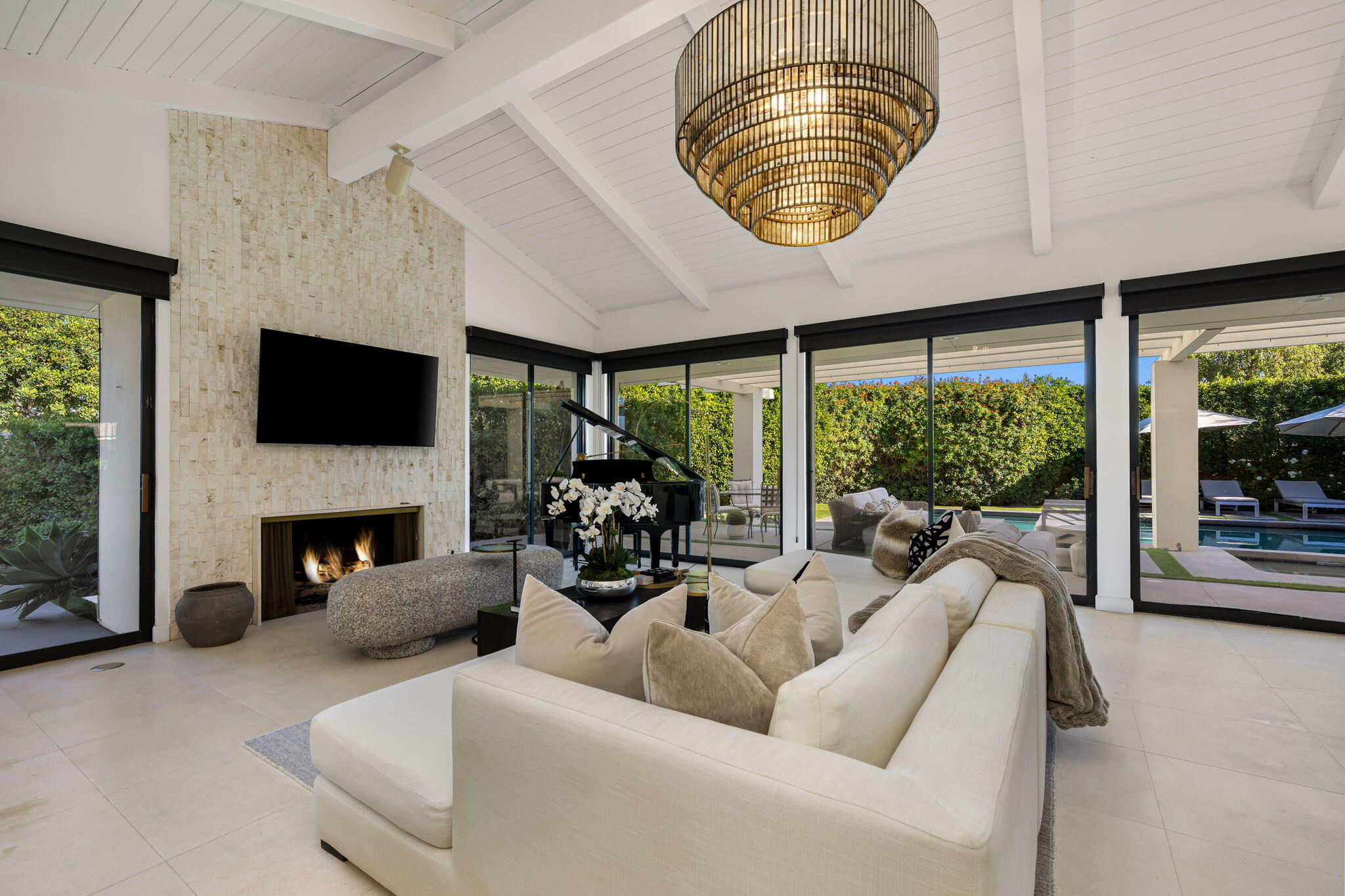 6 Exeter Court Rancho Mirage, CA 92270 - Photo 14 of 54 a living room with furniture a fireplace and a large window