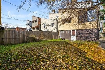 915 2nd Street McKees Rocks, PA 15136 - Photo 17 of 17 a view of a backyard with wooden fence