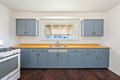 915 2nd Street McKees Rocks, PA 15136 - Photo 8 of 17 a view of a kitchen with a sink and dishwasher next to a window