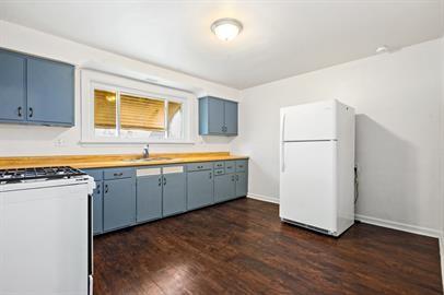 915 2nd Street McKees Rocks, PA 15136 - Photo 9 of 17 a kitchen with sink cabinets and wooden floor