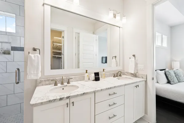 a bathroom with a bathtub and shower