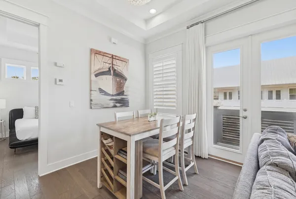 a dining room with furniture and window