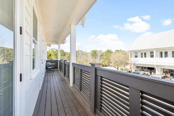 a view of balcony with furniture
