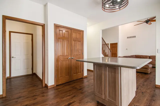 a view of kitchen with cabinets and wooden floor