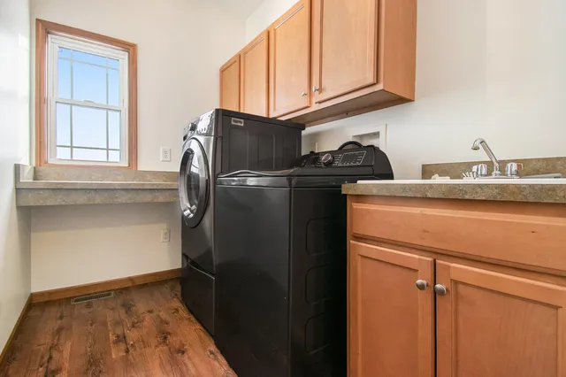 a kitchen with a refrigerator and cabinets