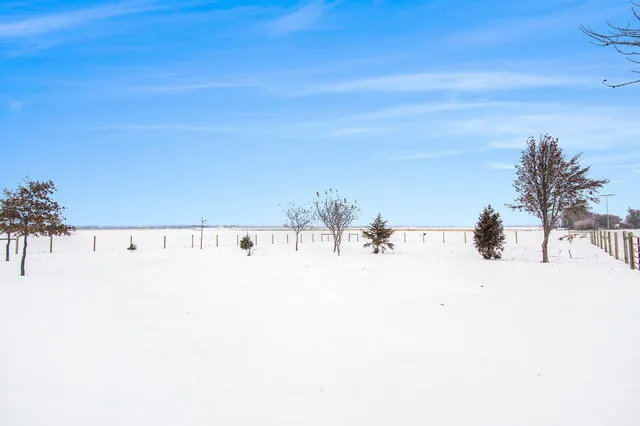 a view of a swimming pool and an outdoor space