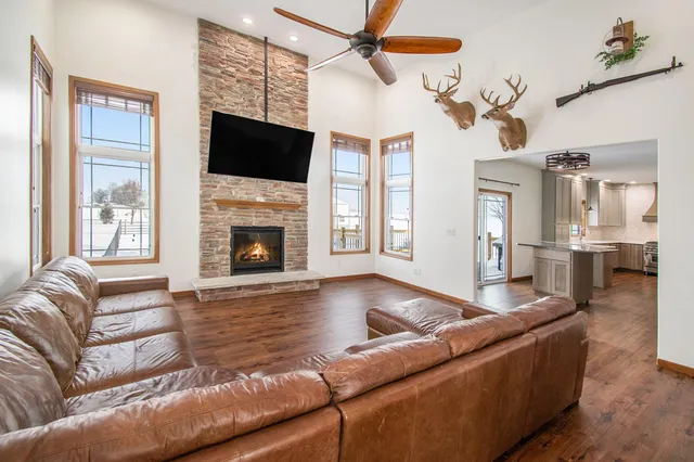 a living room with furniture fireplace and flat screen tv