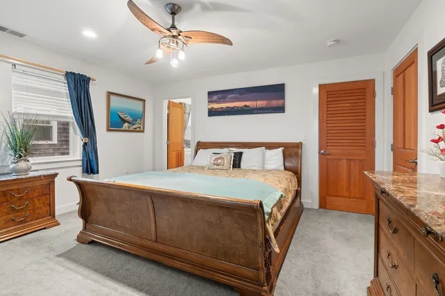 a bathroom with a toilet a sink and a mirror