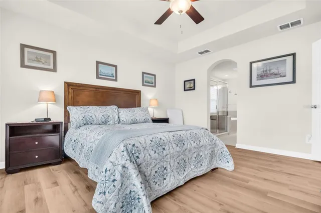 a bedroom with a large bed and a window