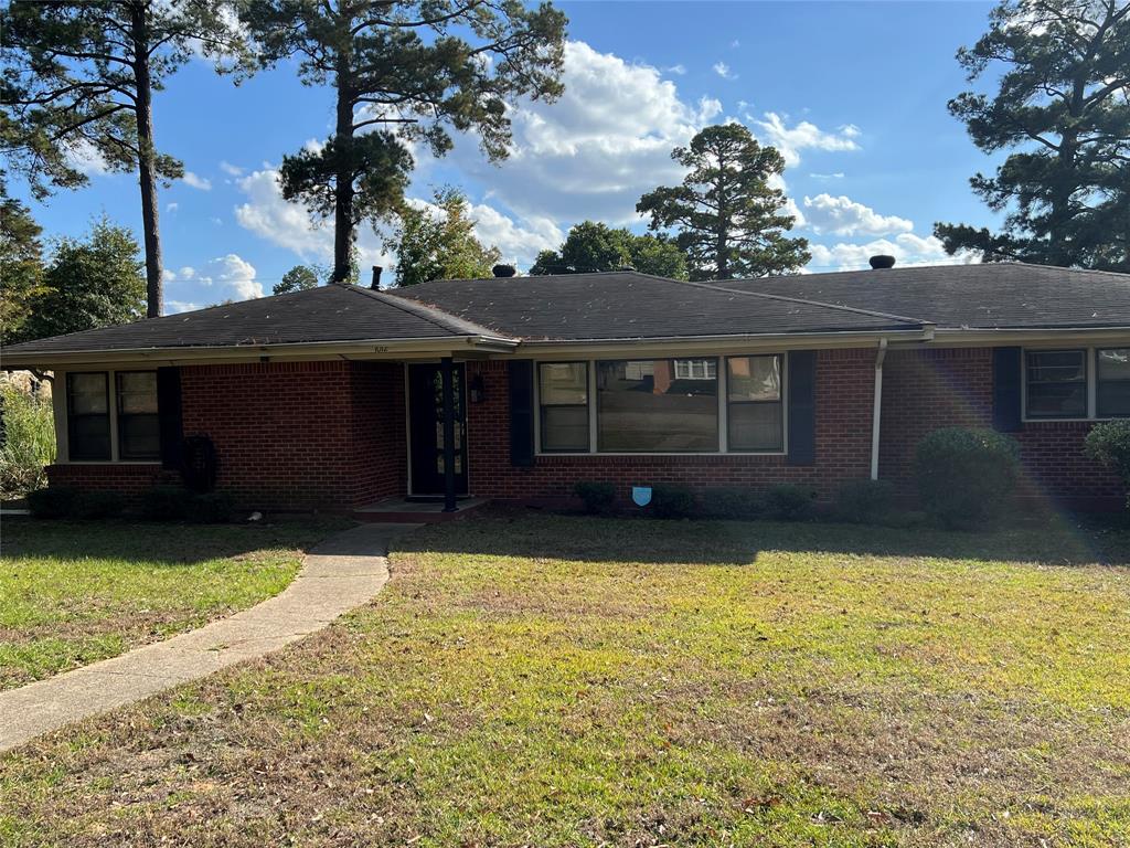 a house view with a garden space