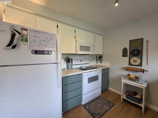 a kitchen with a stove and a refrigerator
