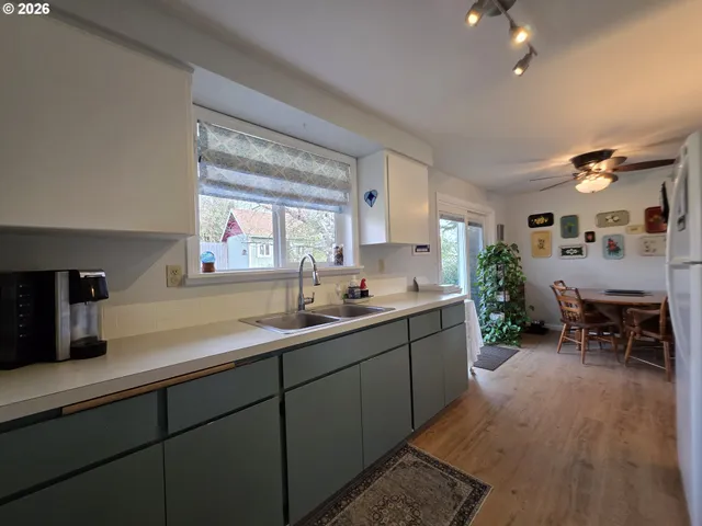 a kitchen with sink cabinets and window