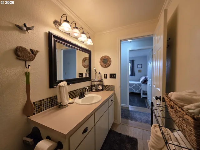 a bathroom with a toilet a sink and a shower