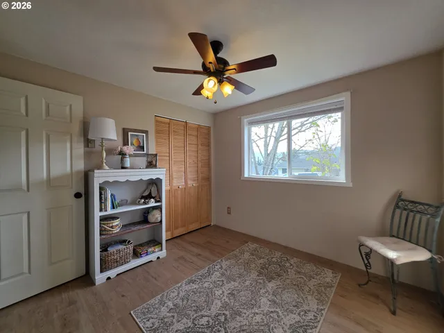 a view of room with furniture and wooden floor