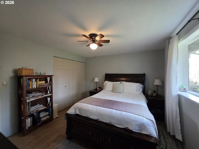 a view of walk in closet with clothes