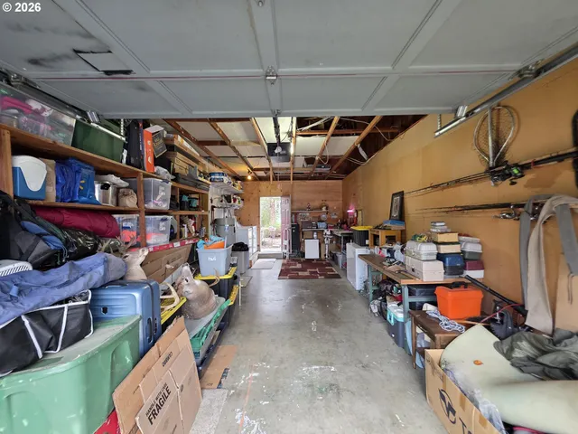 a view of a chairs and table in patio with a yard