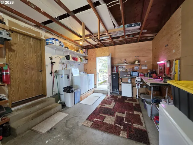 a view of a chairs and table in patio with a yard