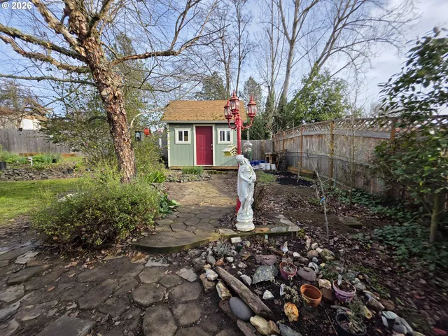 a living room with furniture a rug and a window