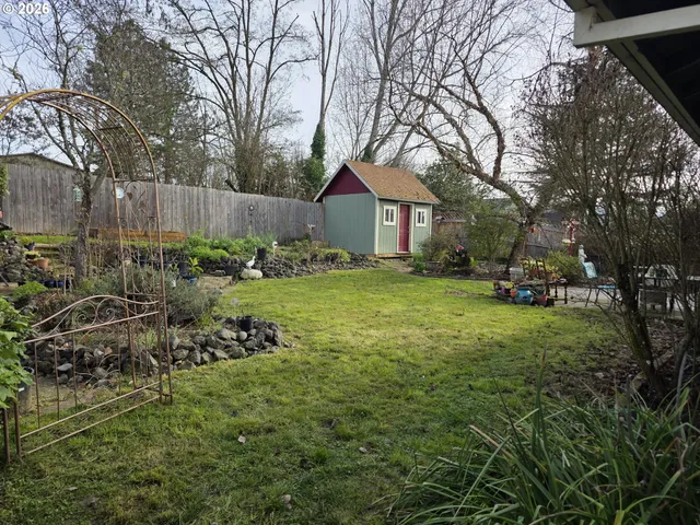 a view of yard with car parked