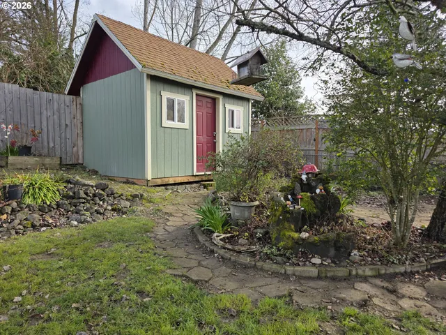 a view of a park with large trees