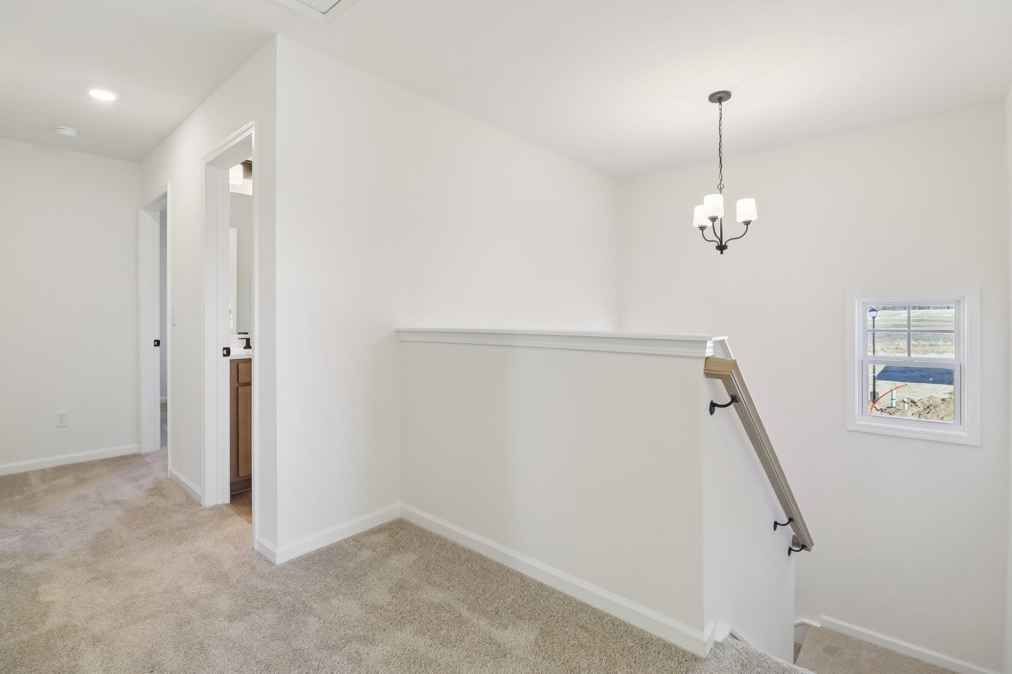 704 Bramble Way Conway, SC 29527 - Photo 11 of 17 Stairway featuring wood finished floors and crown molding