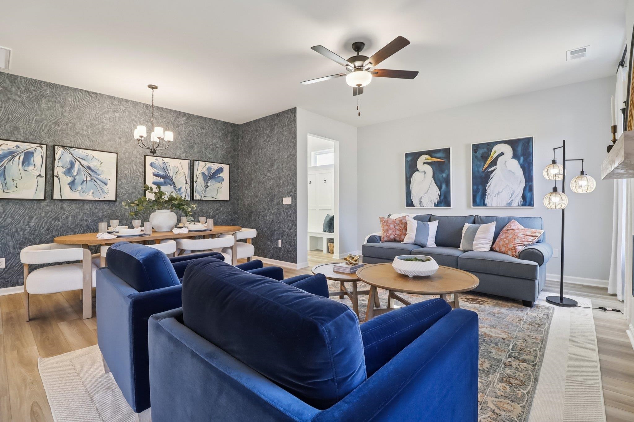 704 Bramble Way Conway, SC 29527 - Photo 5 of 17 Dining area with a chandelier, light wood-style floors, and wallpapered walls