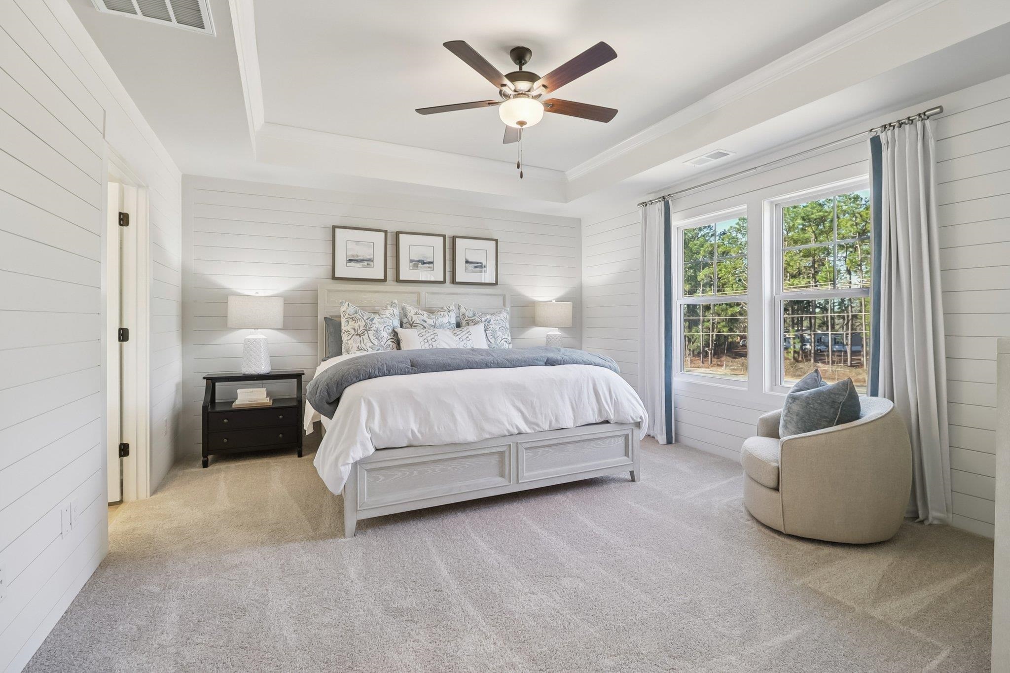 704 Bramble Way Conway, SC 29527 - Photo 6 of 17 Living room with a chandelier, wallpapered walls, a ceiling fan, wood finished floors, and an accent wall
