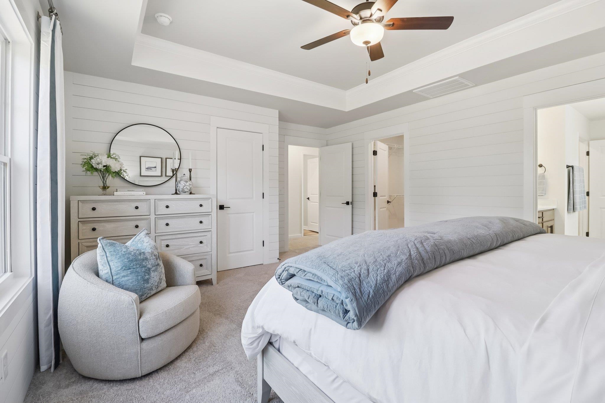 704 Bramble Way Conway, SC 29527 - Photo 7 of 17 Carpeted bedroom with a tray ceiling, wooden walls, and a ceiling fan