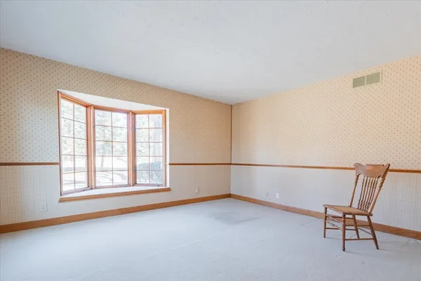 a view of an empty room with a fireplace