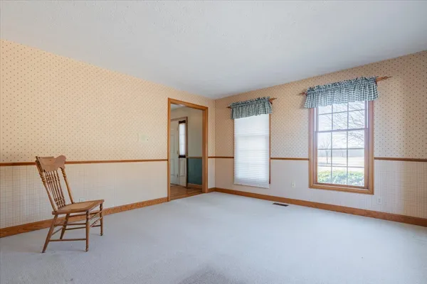 a bathroom with a sink a mirror and a window