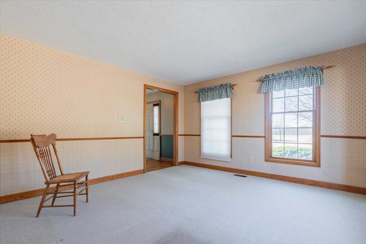 21389 North 2875 East Road Lexington, IL 61753 - Photo 14 of 44 an empty room with windows and ceiling fan