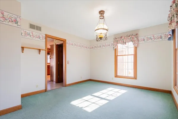 a view of cabinets and utility room with washer and dryer