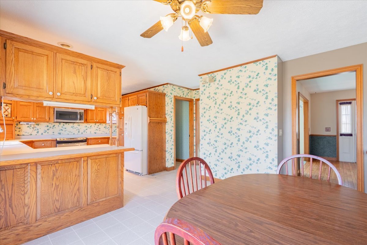 21389 North 2875 East Road Lexington, IL 61753 - Photo 19 of 44 a bedroom with a bed and a chandelier
