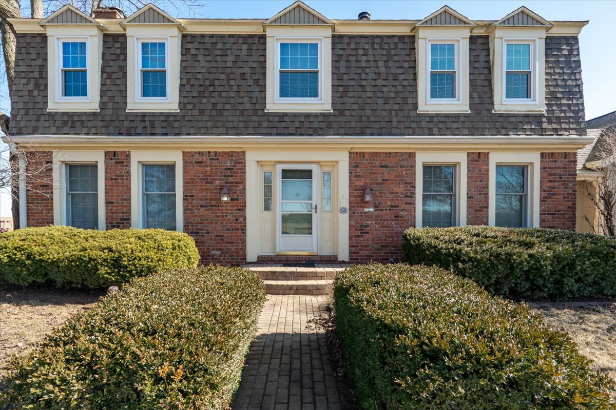 21389 North 2875 East Road Lexington, IL 61753 - Photo 2 of 44 a front view of a brick house with a yard