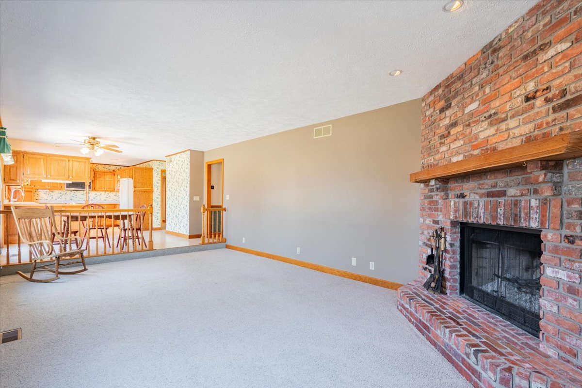 21389 North 2875 East Road Lexington, IL 61753 - Photo 22 of 44 a view of an empty room with a fireplace