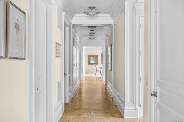 a view of a hallway with a wooden door