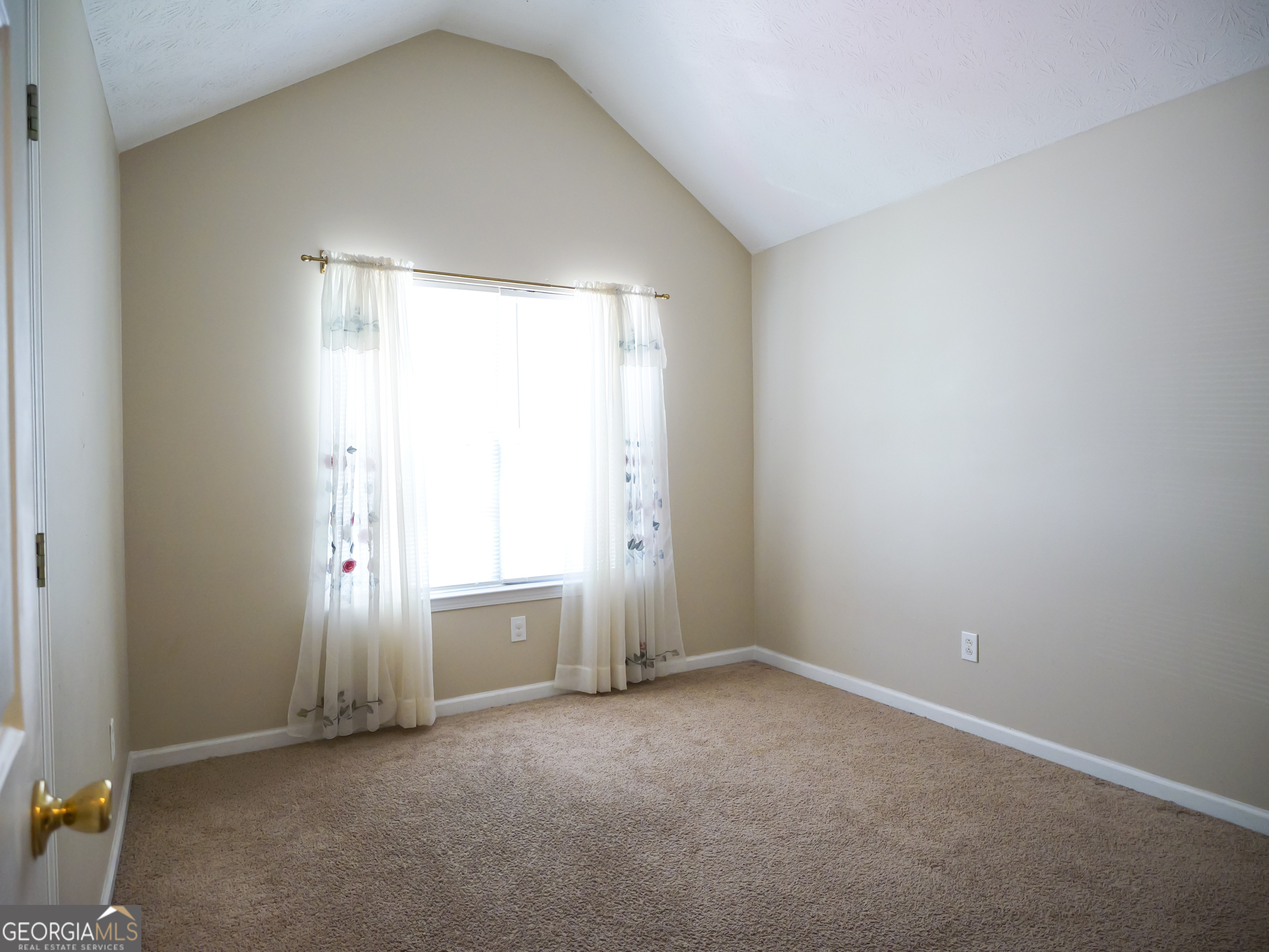 11036 Pebble Ridge Drive Hampton, GA 30228 - Photo 24 of 35 an empty room with a window and a fireplace
