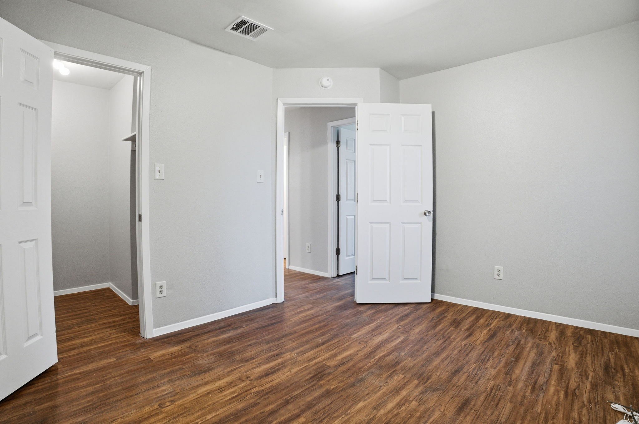 5204 Nuckols Crossing Road, Unit B Austin, TX 78744 - Photo 11 of 16 an empty room with wooden floor and closet